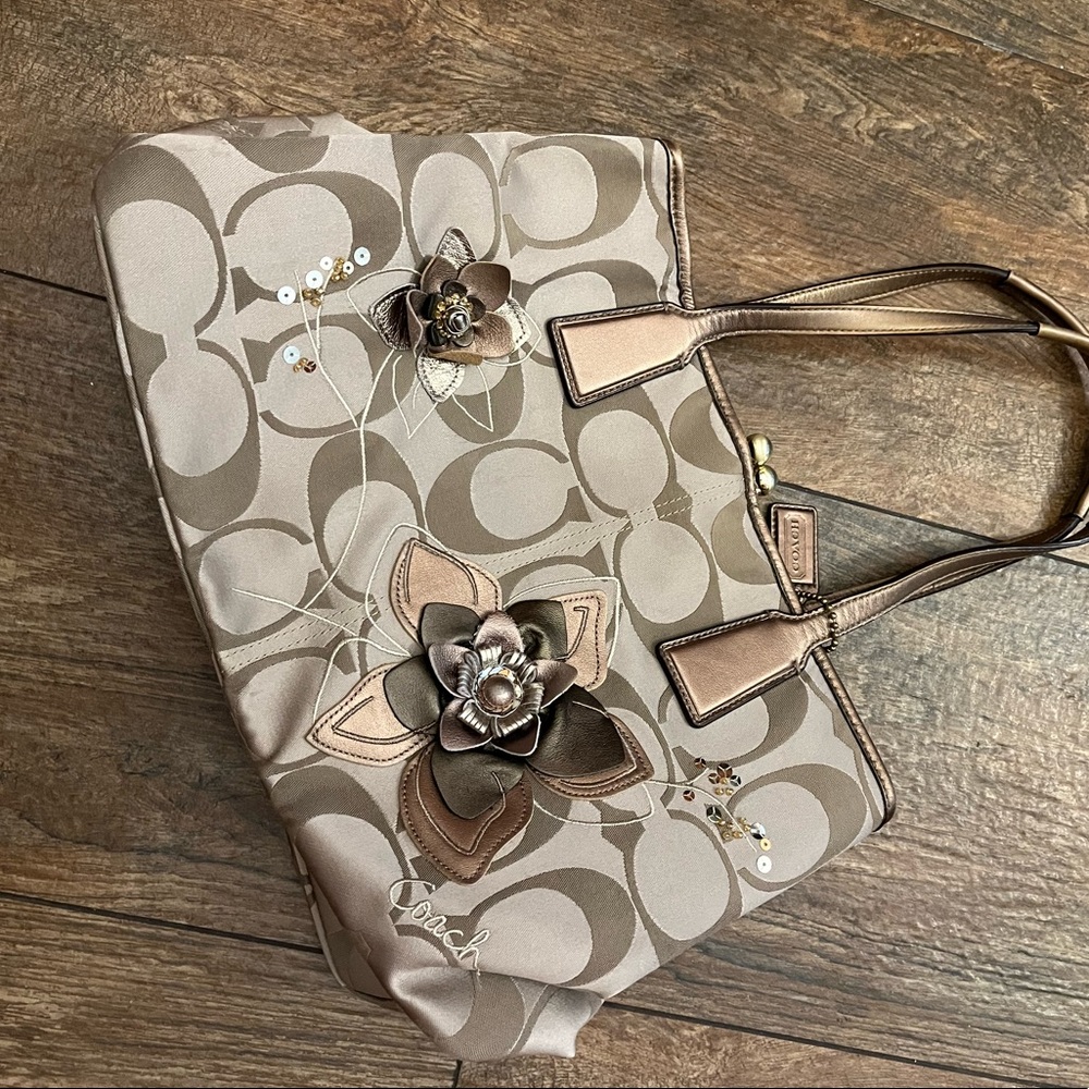 EUC Coach Signature Tote with Metallic leather flower details